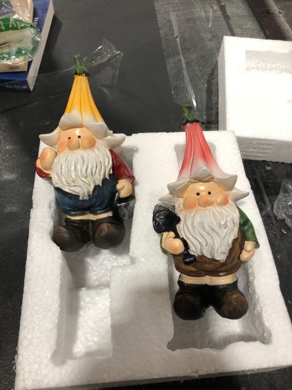 Photo 2 of E.SUN CRAFT Garden Gnome Statues Resin Gnome Elf Ready Work Figurines Wearing a Flower Hat Holding Tools Outdoor Art Decorations Patio Yard Lawn Porch Housewarming Gift Set 2, 3.15×2.95×6.5 inches
