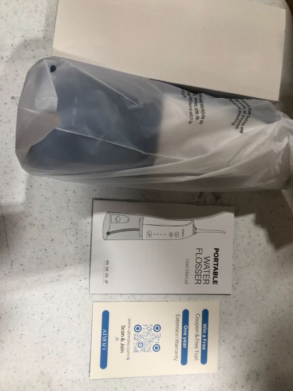 Photo 1 of ATMOKO Portable Dental Oral Irrigator for Teeth, 3 Modes and 8 Jet Tips, IPX7 Waterproof, USB Charged 4 Hrs Blue