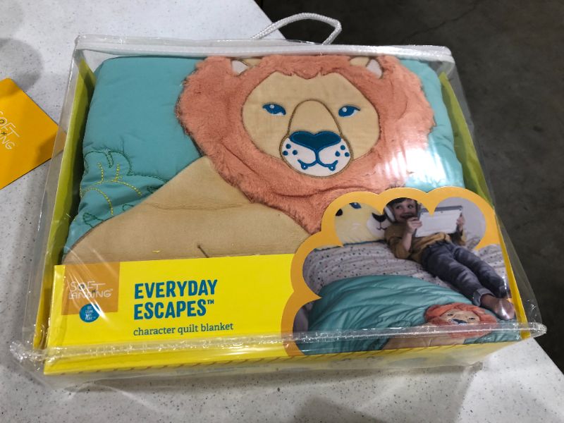 Photo 1 of Soft Landing | Everyday Escapes | Premium 45" x 40" Children’s Character Quilt – Jungle Lion
