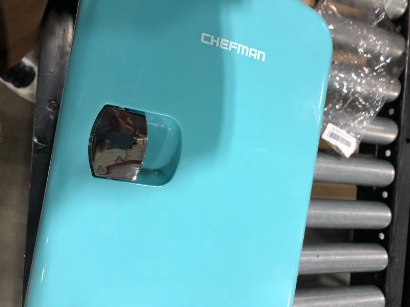 Photo 2 of Chefman Mini Portable Blue Personal Fridge Cools Or Heats & Provides Compact Storage For Skincare, Snacks, Or 6 12oz Cans W/ A Lightweight 4-liter Capacity To Take On The Go
