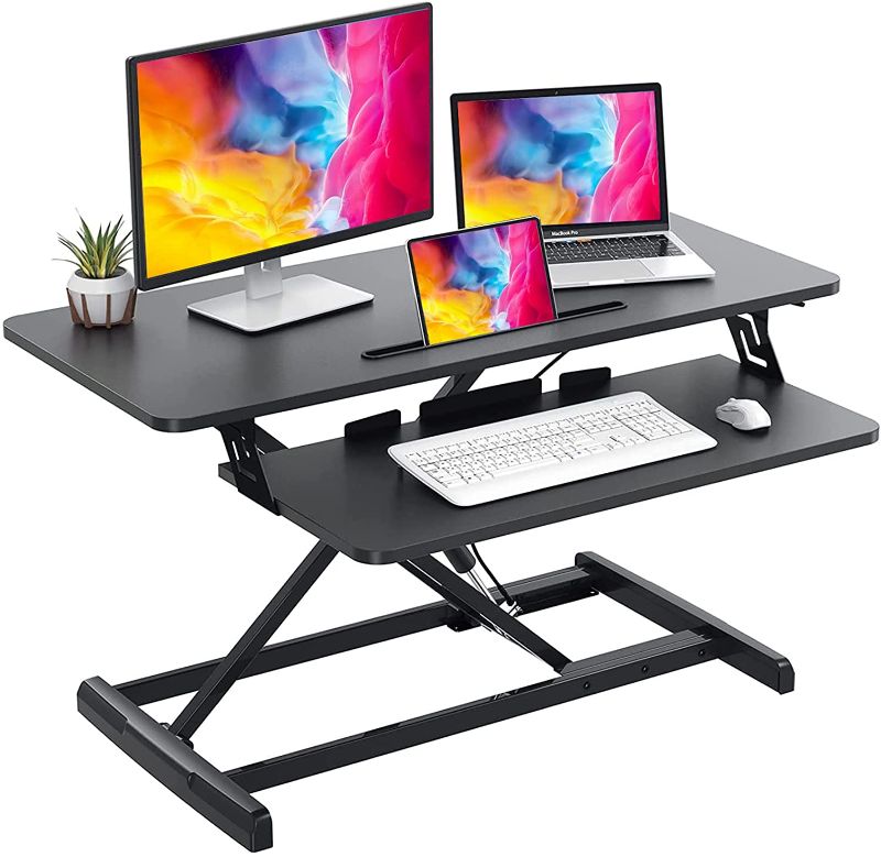 Photo 1 of Quick Sit to Stand Desktop Gas Spring Riser (Max Height:19.3inch), 33 inch Height Adjustable Standing Desk Converter for Dual Computer Monitors & Laptop Workstation, Perfect Home Office by HUANUO
