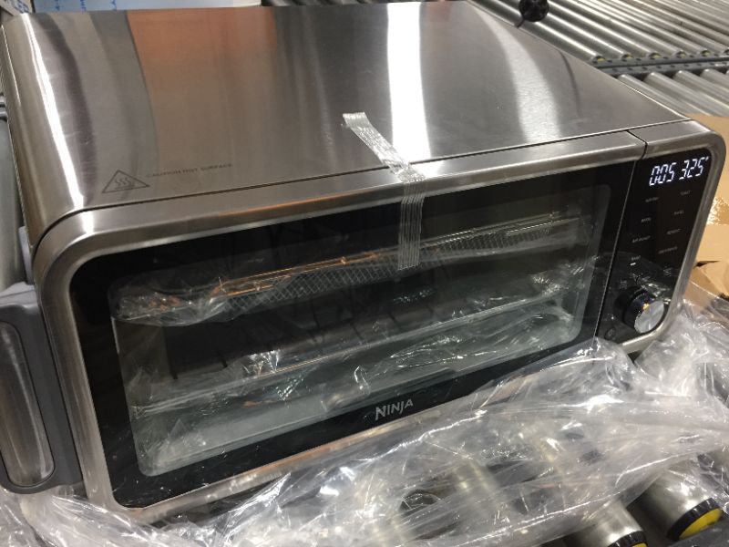 Photo 4 of Ninja SP201 Digital Air Fry Pro Countertop 8-in-1 Oven with Extended Height, XL Capacity, Flip Up & Away Capability for Storage Space, with Air Fry Basket, Wire Rack & Crumb Tray, Silver
