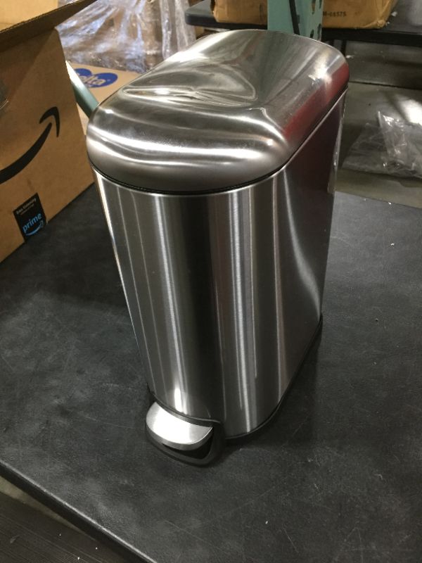 Photo 2 of Amazon Basics 10 Liter / 2.6 Gallon Soft-Close, Smudge Resistant Trash Can with Foot Pedal for Narrow Spaces - Brushed Stainless Steel
