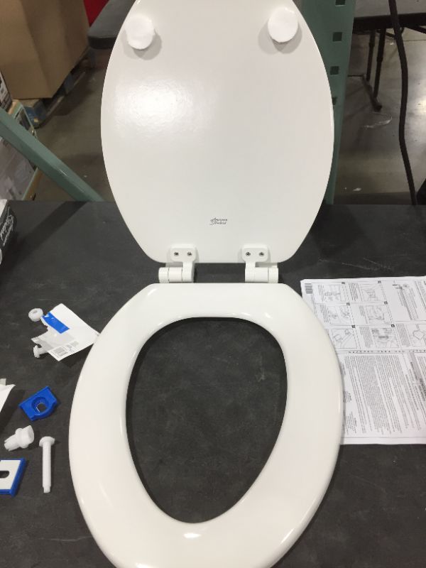 Photo 2 of American Standard Contemporary Slow-Close Elongated Closed Front Toilet Seat with Trivantage and Flat Bumpers in Linen
