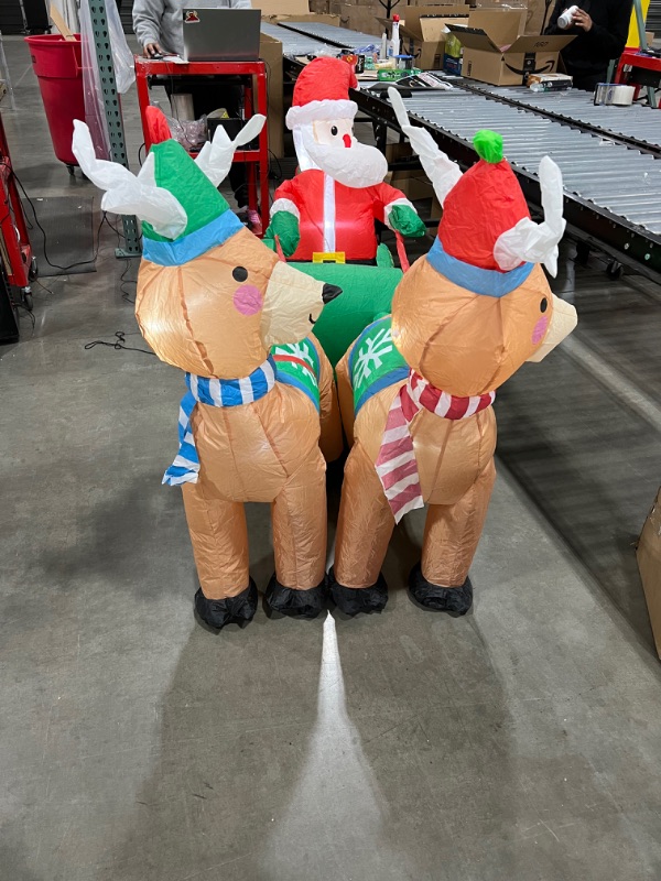 Photo 2 of  Santa on Sleigh with Reindeers Inflatable 74IN X 24IN 