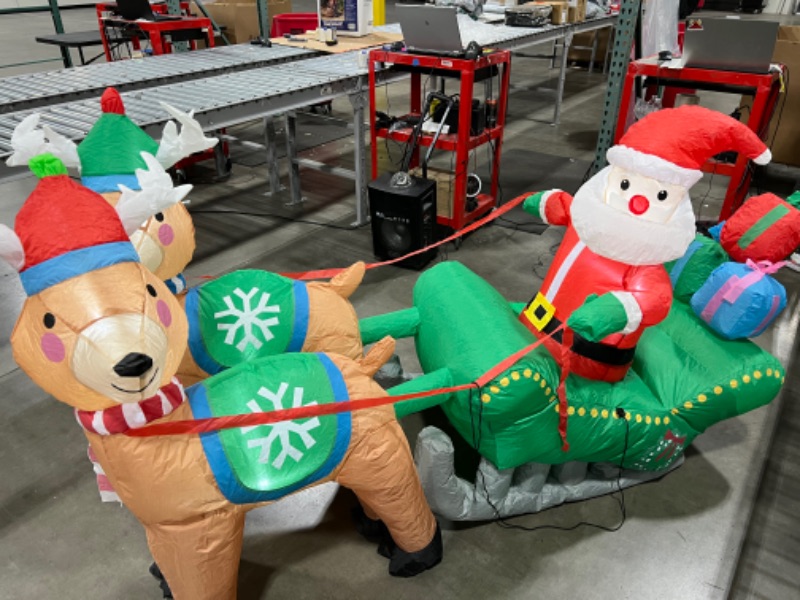 Photo 1 of  Santa on Sleigh with Reindeers Inflatable 74IN X 24IN 