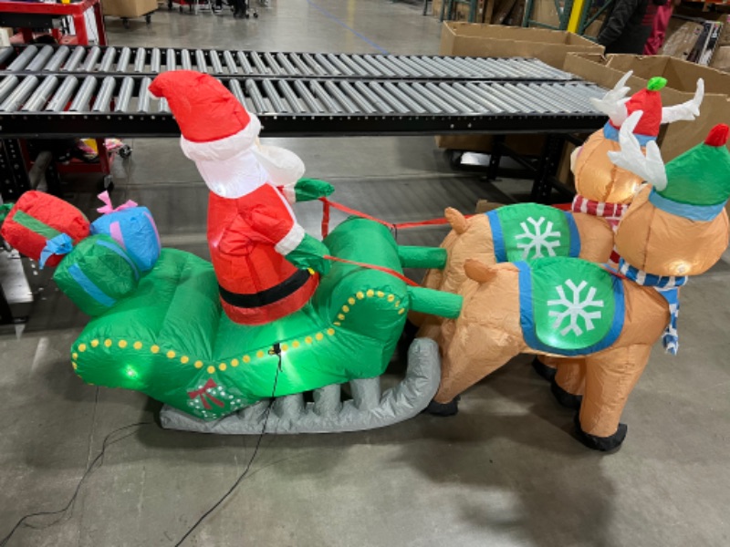 Photo 3 of  Santa on Sleigh with Reindeers Inflatable 74IN X 24IN 