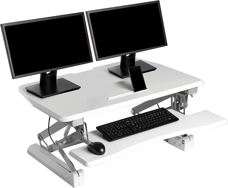 Photo 1 of Seville Classics OFF65808 Airlift 36" Gas-Spring Height Adjustable Standing Desk Converter Workstation Ergonomic Dual Monitor Riser with Keyboard Tray and Phone/Tablet Holder Full White