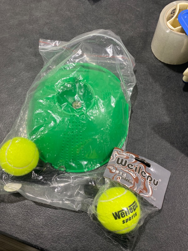 Photo 1 of x-xds-tennis-green tennis holder and two tennis balls 