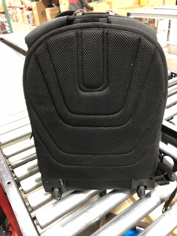 Photo 1 of Black samsonite backpack, five outer compartment/pockets 