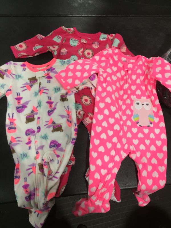 Photo 2 of Simple Joys by Carter's Baby and Toddler Girls' 3-Pack Loose Fit Fleece Footed Pajamas
SIzE 12MOS