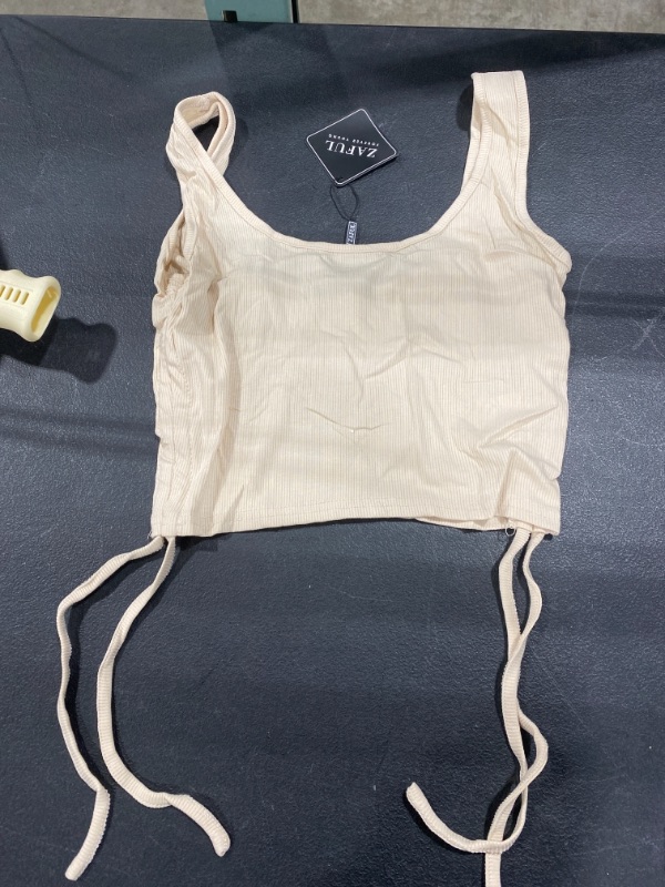 Photo 1 of Medium, tan tank top with side bow string 