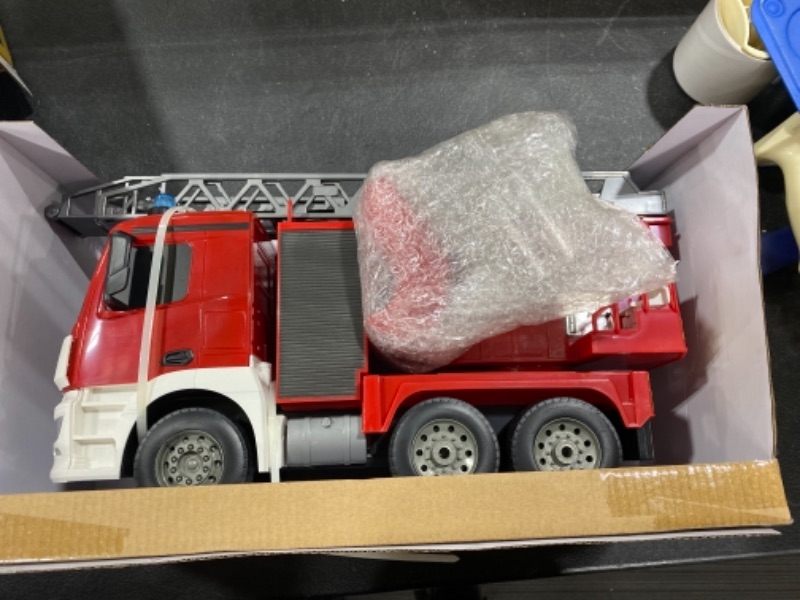 Photo 2 of DOUBLE E Benz Licensed Remote Control Fire Truck Shoots Water Extendable 18 Inch Rescue Ladder 10 Channel Fire Engine Working Sounds Lights RC Trucks for Kids
