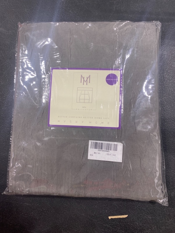 Photo 1 of 63" grey curtains 
SHEER WITH A CRINKLED DESIGN