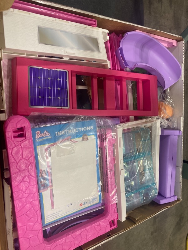 Photo 4 of Barbie Dreamhouse Dollhouse with Wheelchair Accessible Elevator, Pool, Slide and 70 Accessories Including Furniture and Household Items
