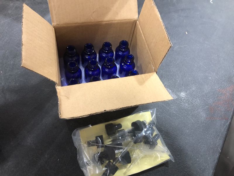 Photo 2 of 12 Pack 30 ml 1 oz Blue Glass Bottles with Glass Droppers and Black cap.Glass Dropper Bottles for Essential Oils,Lab Chemicals,Colognes,Perfumes.Included 1 Brush,2 Funnels and 24 Labels.
