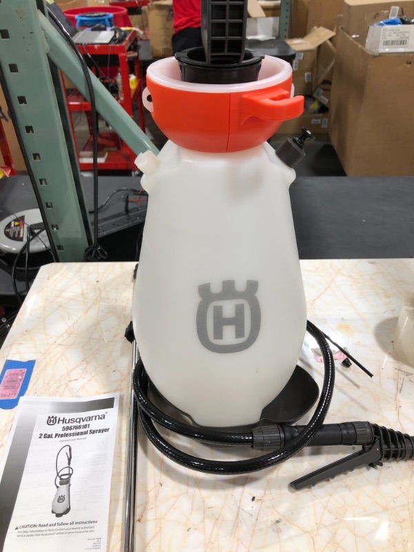 Photo 2 of Genuine Husqvarna 596766101 2 Gallon Pump Sprayer with 3 Nozzle Kit