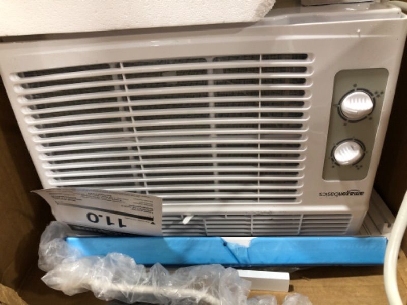 Photo 1 of Amazon Basics Window-Mounted Air Conditioner with Mechanical Control - Cools 150 Square Feet, 5000 BTU, AC Unit
