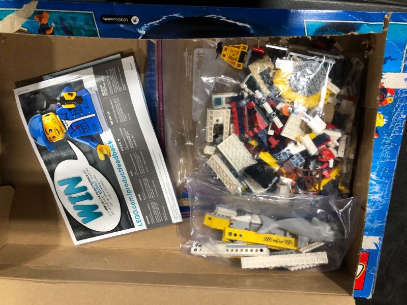 Photo 2 of LEGO City Ocean Exploration Ship 60266, Toy Exploration Vessel, Mini Helicopter, Submarine, Shipwreck with Treasure, Lifeboat, Stingray, Shark, Plus 8 Minifigures (745 Pieces)
