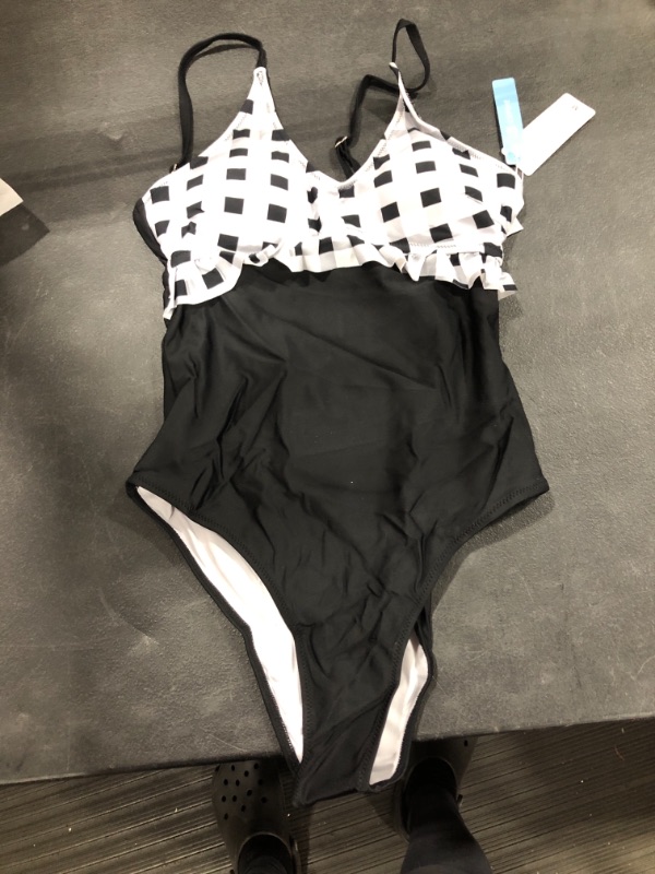 Photo 1 of Black and white one piece womens bathing suit