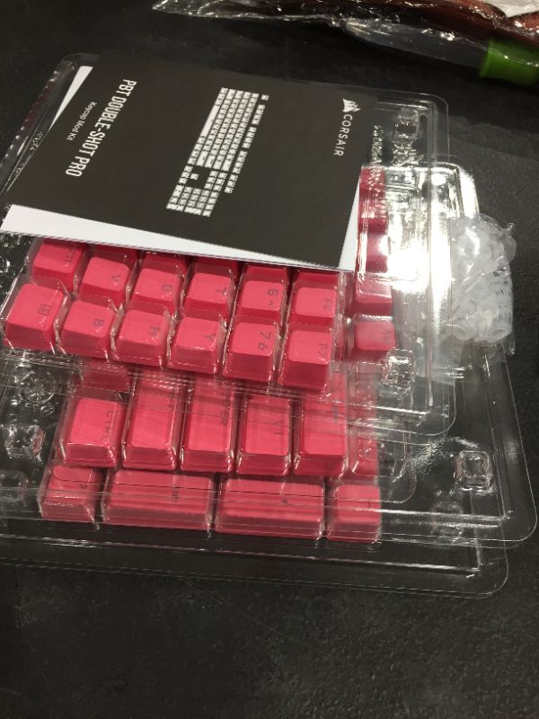 Photo 2 of CORSAIR PBT Double-Shot PRO Keycap Mod Kit – Double-Shot PBT Keycaps – Rogue Pink – Standard Bottom Row – Textured Surface – 1.5mm-Thick Walls – O-Ring Dampeners
