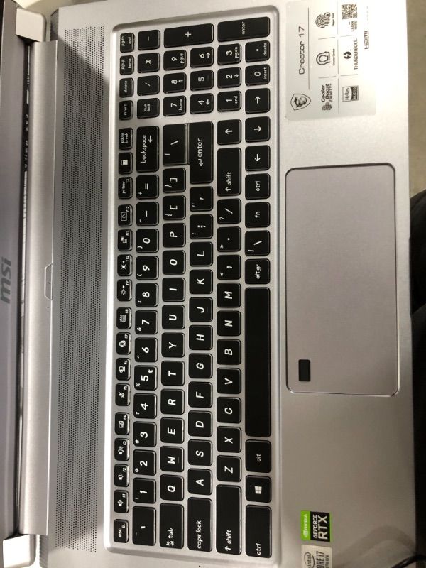 Photo 5 of MSI Laptop Intel Core i7 10th Gen 10875H (2.30 GHz) 16 GB Memory 512 GB NVMe SSD NVIDIA GeForce RTX 2070 Max-Q 17.3" Windows 10 Pro 64-bit  **DOES NOT TURN ON ** HAS A DENT ON THE TOP, also missing ram module, For parts only