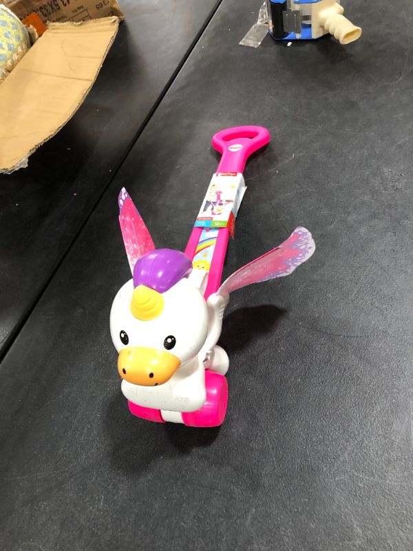 Photo 2 of Fisher-Price Push & Flutter Unicorn
