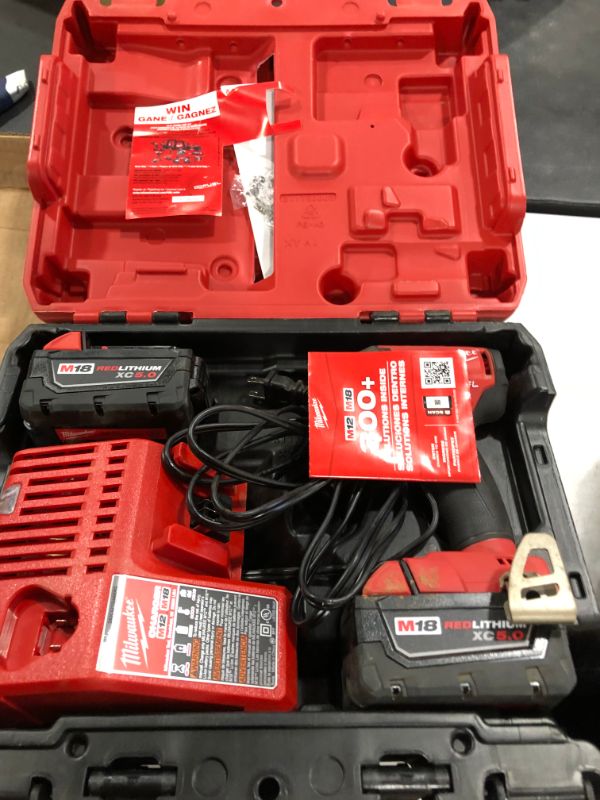 Photo 1 of M18 FUEL SURGE 18-Volt Lithium-Ion Brushless Cordless 1/4 in. Hex Impact Driver Compact Kit with Two 5.0 Ah Batteries
