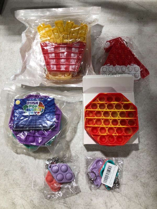 Photo 1 of VARIOUS POP FIDGET SENSORY TOYS. LOT OF 6 ITEMS.