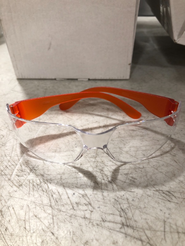 Photo 1 of BOX OF SAFETY GLASSES. VARIOUS COLORS. UNKNOWN QUANTITY. ONE SIZE.