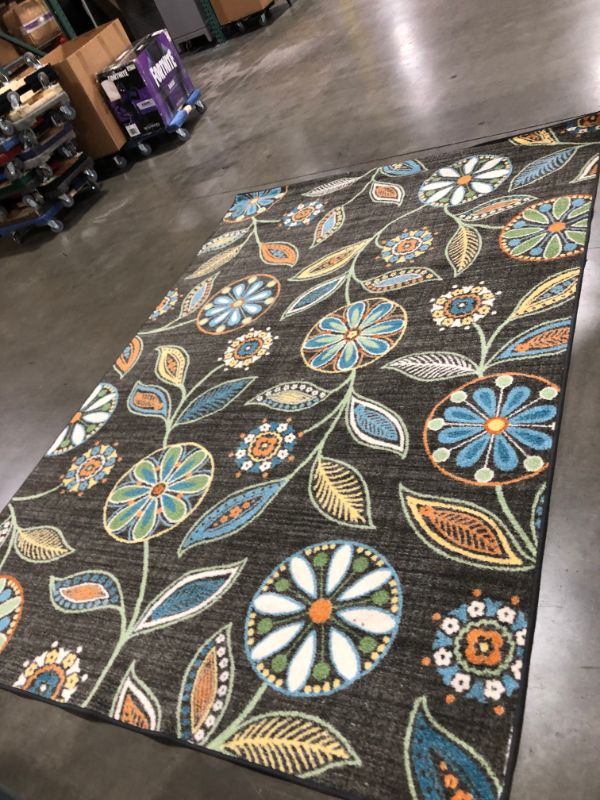 Photo 1 of 7x10 area rug small rip