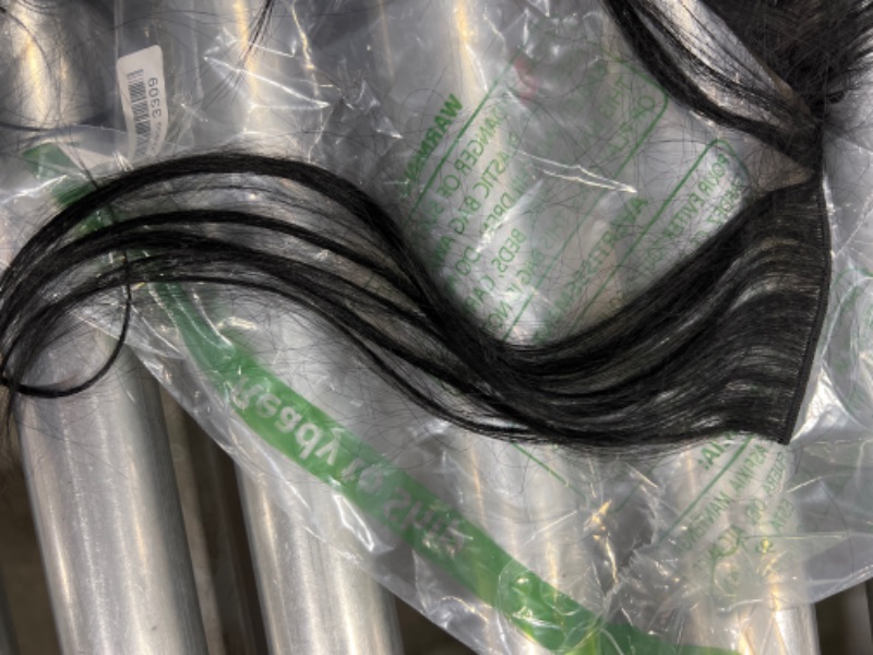 Photo 1 of Black glue on hair extensions 