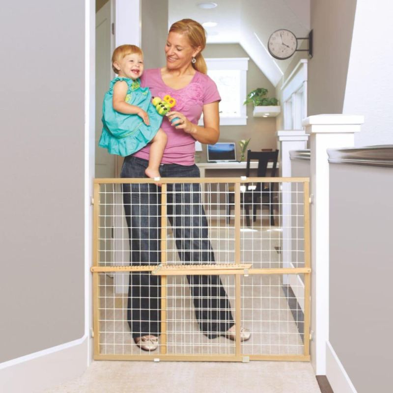 Photo 1 of Toddleroo by North States 50" Wide Extra Wide Wire Mesh Baby Gate, Made in USA: Installs in Wide Opening Without damaging Wall. Pressure Mount. Fits 29.5"-50" Wide (32" Tall, Sustainable Hardwood)