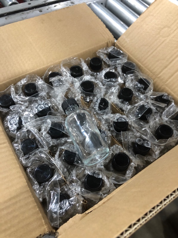 Photo 1 of Bekith 30 Pack 2 oz Small Clear Glass Bottles, Boston Round Sample Bottles with Black Poly Cone Cap for Potion, Juice, Ginger Shots, Oils, Whiskey, Liquids
