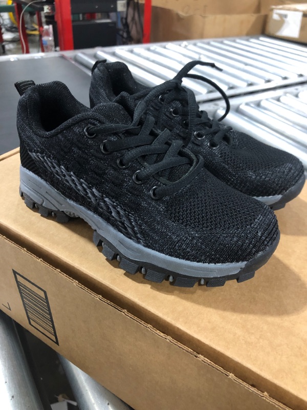 Photo 1 of Boys' black running shoes (Size 12)