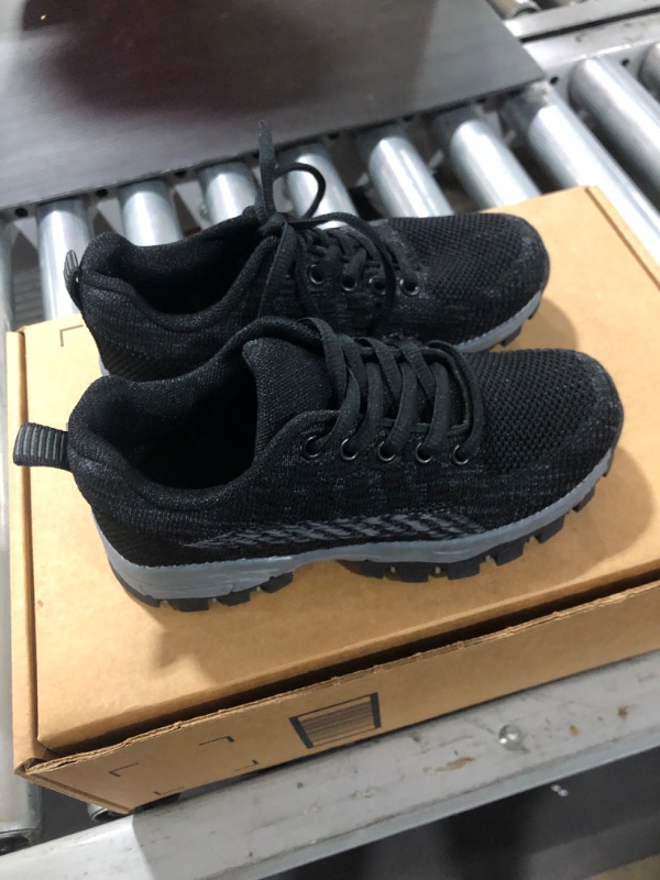 Photo 2 of Boys' black running shoes (Size 12)