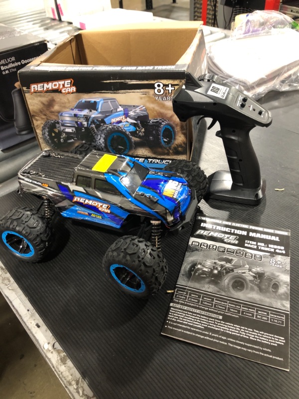 Photo 2 of GoolRC RC Car, 1/16 Scale 4WD 30km/h High Speed RC Car, 2.4Ghz Remote Control Off Road Monster Truck Electric Vehicle Toy for Adult Kids (Blue)
