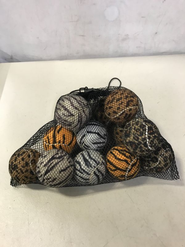 Photo 1 of dog chew toys 12 ct major damages to one ball