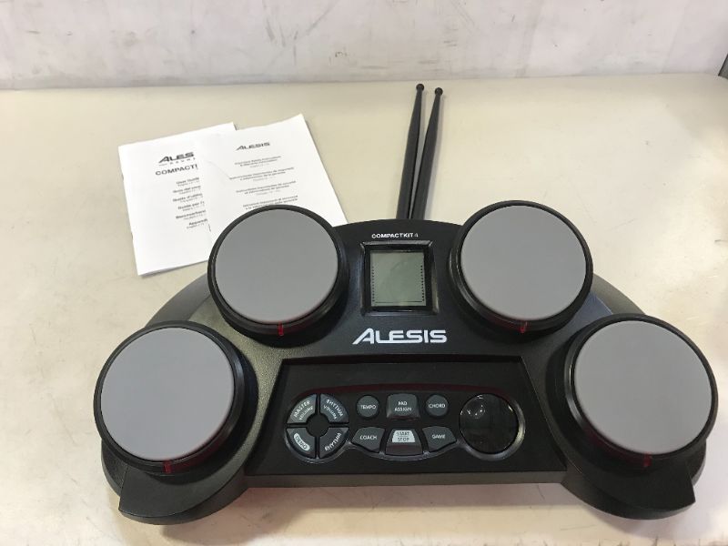 Photo 5 of Alesis CompactKit 4 – Tabletop Electric Drum Set with 70 Electronic and Acoustic Drum Kit Sounds, 4 Pads, and Drum Sticks
BOTTOM LEFT DRUM DOSENT WORK, MISSING PLUGS, NEEDS C BATTERIES 