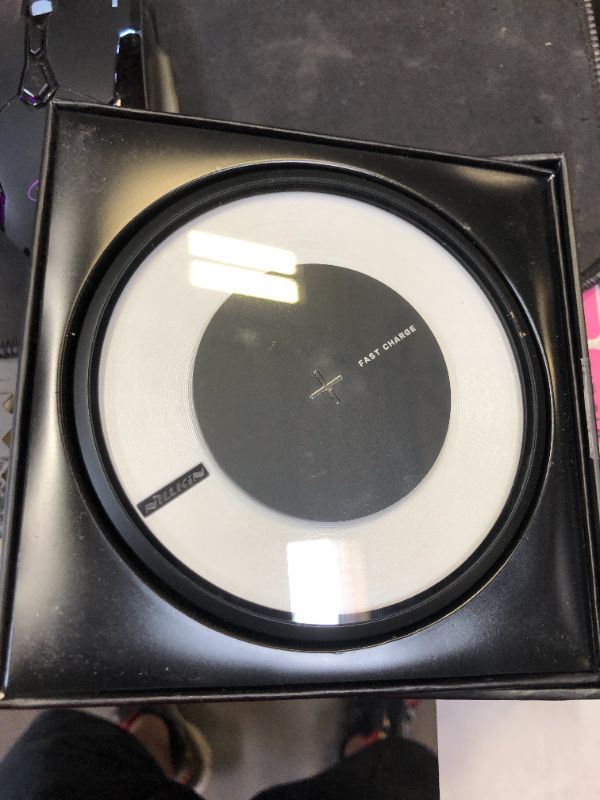 Photo 2 of Wireless Charger, Nillkin Qi Certified10W Fast Wireless Charging Pad with Colorful LED Light [Magic Disk 4] for iPhone Xs Max/XR/XS/X/8/8 Plus, Pixel 3/3XL, Samsung Galaxy Note 9/S9/S9 Plus and More
