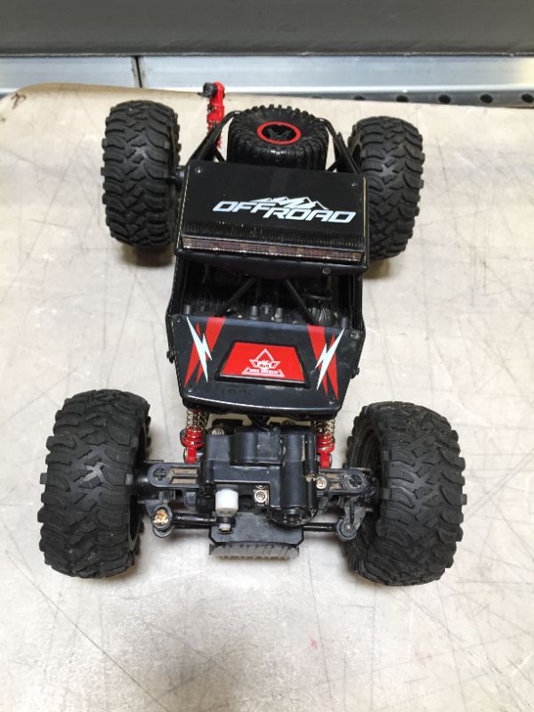 Photo 3 of TEMI RC Cars 1:14 Scale Remote Control Car, 4WD Dual Motors Rock Crawler, Speed 20 Km/h All Terrains Electric Toy Off Road RC Monster Truck with Two Rechargeable Batteries for Boys Kids and Adults---ITEM IS DIRTY---
