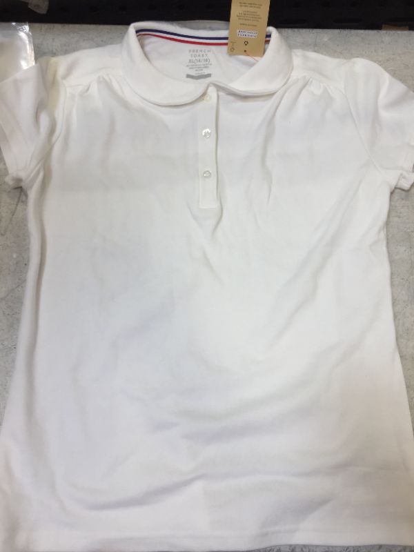 Photo 1 of young child shirt polo style color white size extra large 14-16 