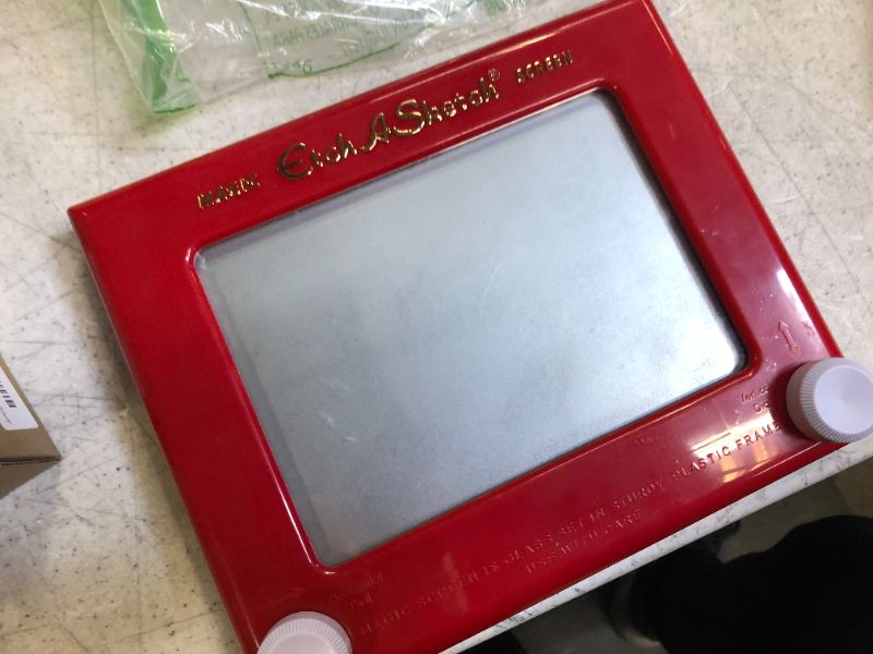 Photo 2 of Etch A Sketch, Classic Red Drawing Toy with Magic Screen, for Ages 3 and Up

