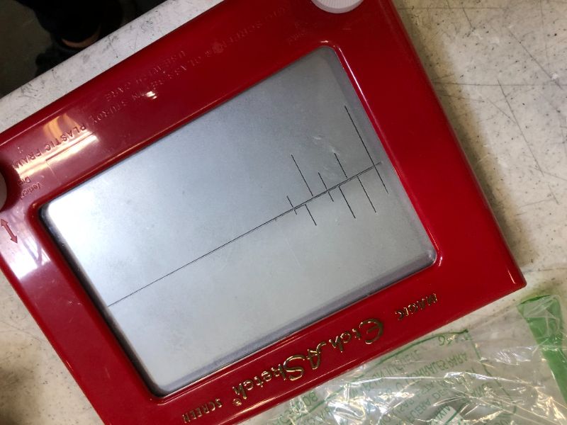 Photo 3 of Etch A Sketch, Classic Red Drawing Toy with Magic Screen, for Ages 3 and Up
