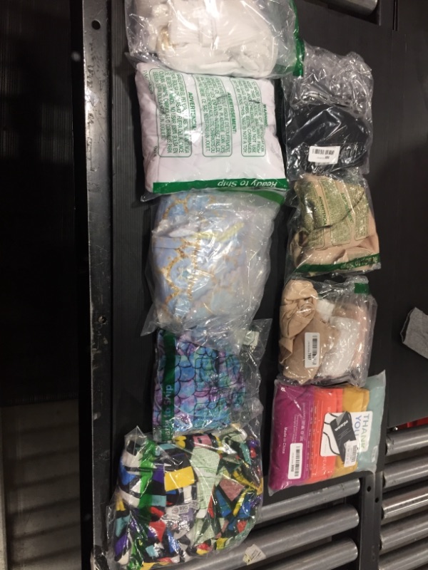 Photo 1 of MISC CLOTHING BAG LOT 
SOLD AS IS 
VARIOUS SIZES AND STYLES