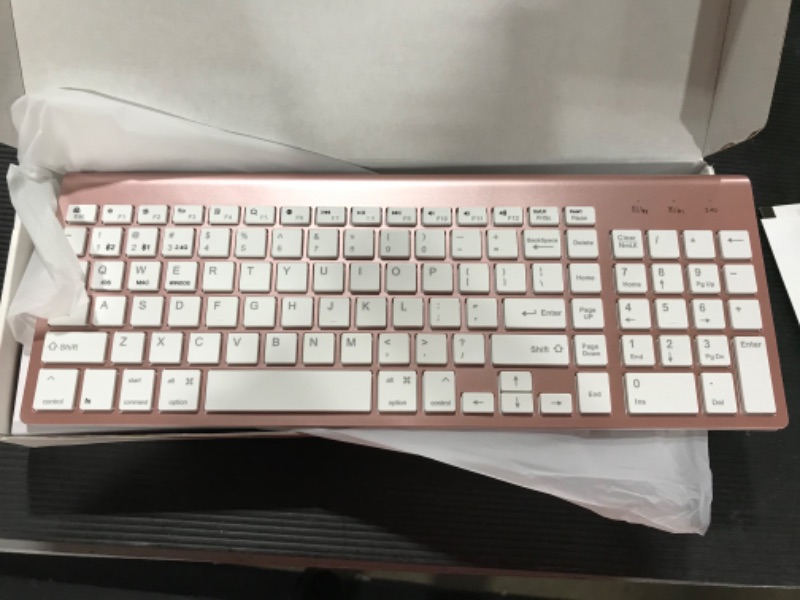 Photo 1 of Bluetooth Keyboard, Pink Wireless Keyboard with Number Pad, J JOYACCESS Dual Mode Slim Keyboard Connects Up to 3 Devices for iMac/Mac,MacBook, iPad,Laptop,Android,Windows
