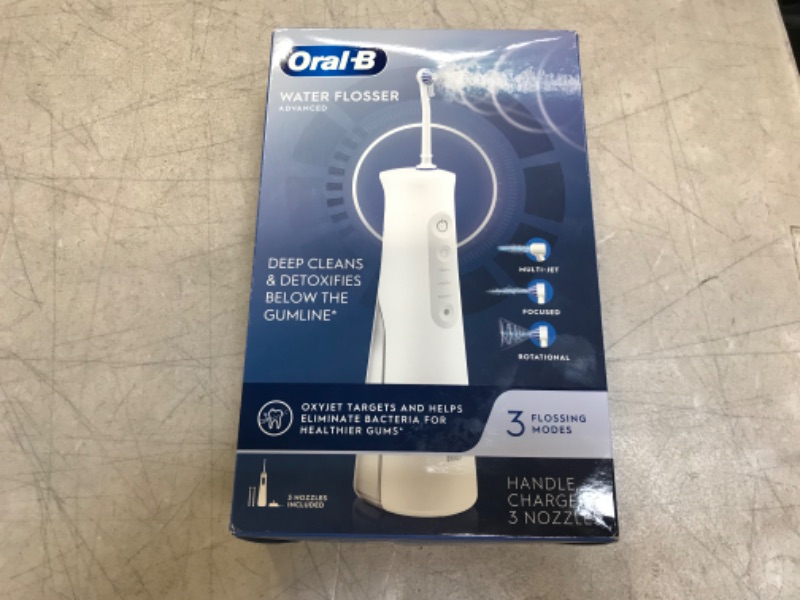 Photo 2 of Oral-B Water Flosser Advanced, Cordless Portable Oral Irrigator Handle with 3 Nozzles -- Used