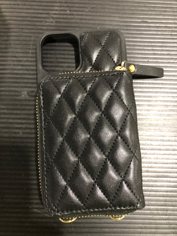 Photo 1 of Black embroidered cell phone case with zip wallet and crossbody and wrist strap.