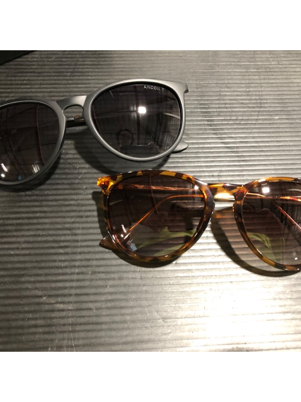 Photo 1 of 2 pairs of vintage polarized sunglasses for women with brown and grey gradiant lens