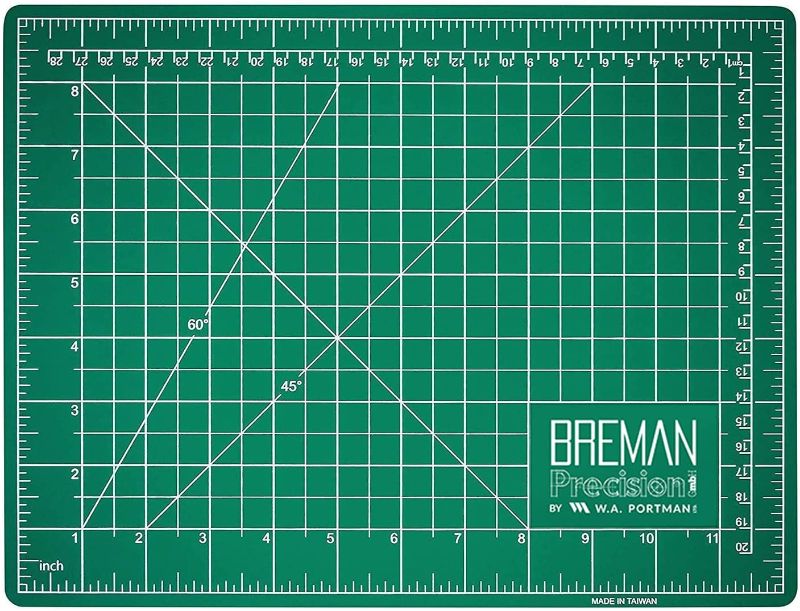 Photo 1 of Breman Precision Self Healing Cutting Mat 9x12 Inch - Rotary Cutting Mats for Crafts - Great Cutting Mat for Sewing Crafting & Quilting - 2 Sided 5 Ply PVC Self Healing Hobby Mat - Craft Cutting Mat
with blade 